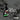 Spray bottle of 'Mould Shield' on a textured surface with mould. With the text "kills mould to the roots"
