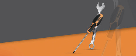 Beta tools logo in white, black and orange on a grey background
