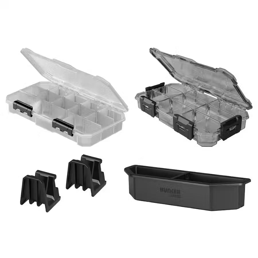Clear and black plastic storage boxes with components on a white background