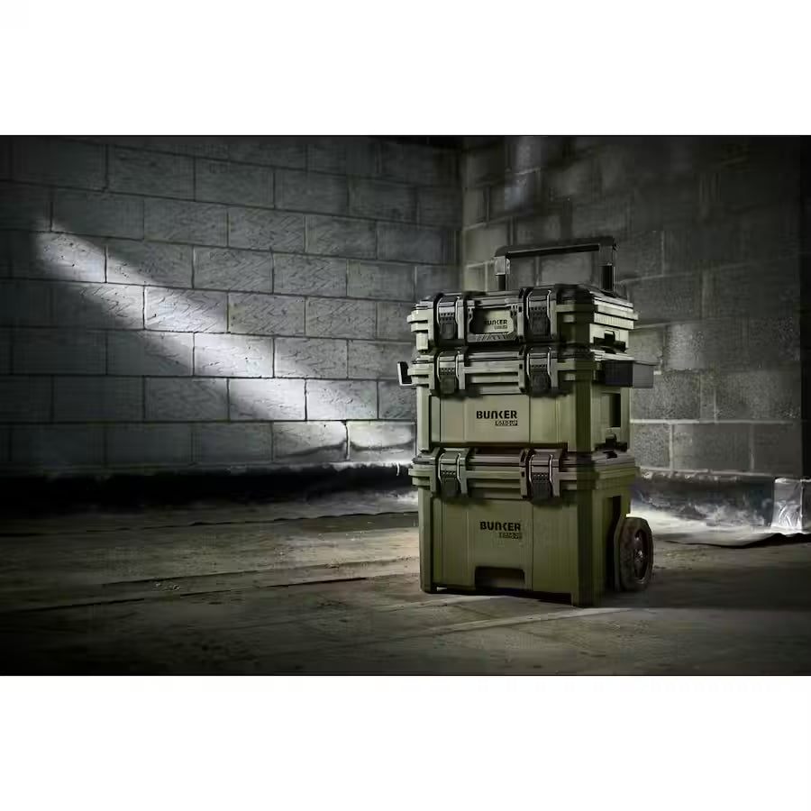 Stack of toolboxes with 'Bunker' branding against a brick wall.