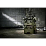 Stack of toolboxes with 'Bunker' branding against a brick wall.