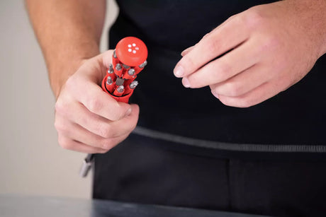 Person holding a Whia 38606 screwdriver with multiple components.