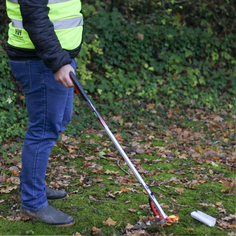 Helping Hands Litter Picker PRO Litter Grabber 33″/ 85cm being used to collect litter from on the ground