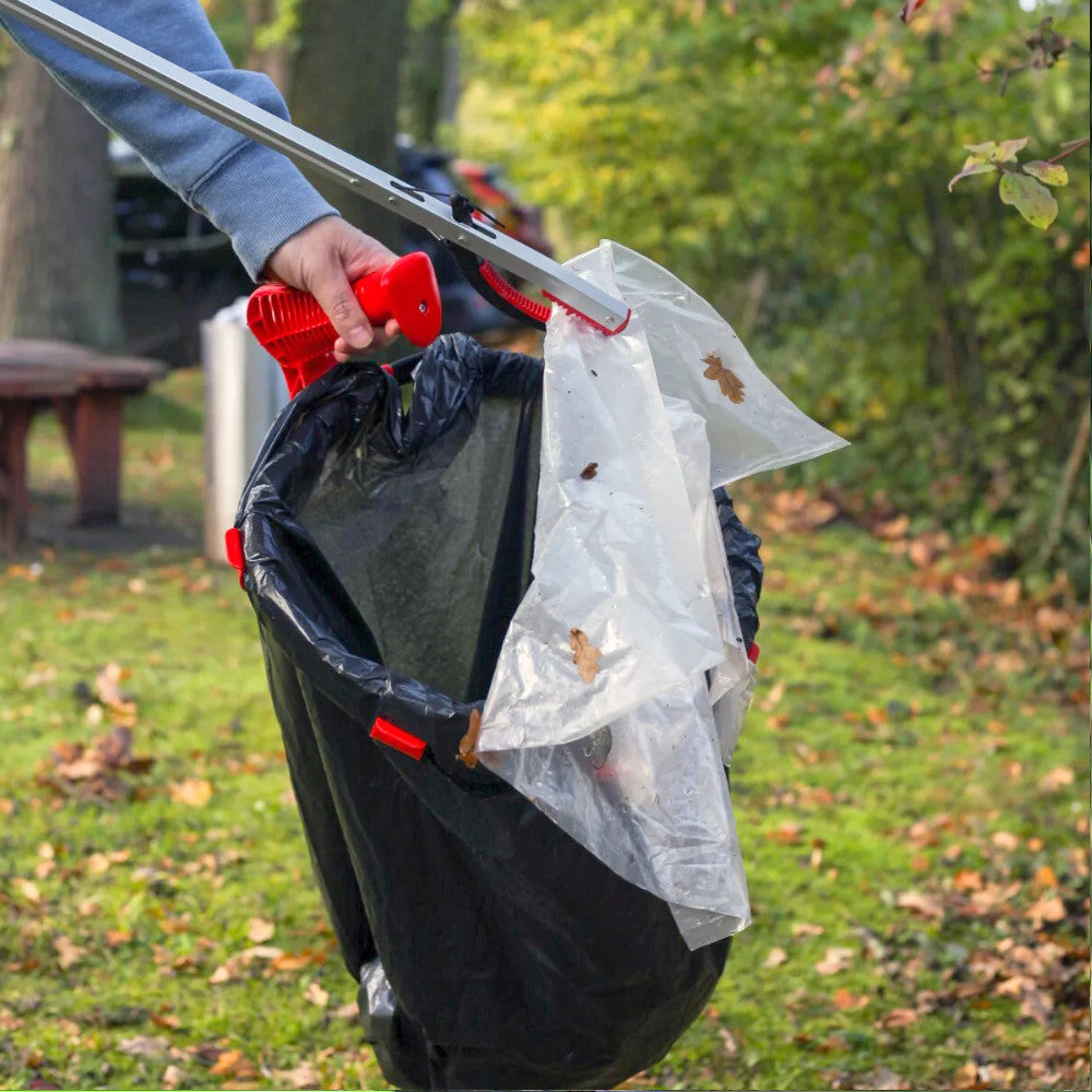 image showing the Helping Hands Litter Picker PRO Litter Grabber 33″/ 85cm putting a plastic bag in the bin