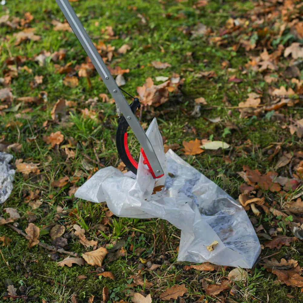 image showing the Helping Hands Litter Picker PRO Litter Grabber 33″/ 85cm grabbing a clear plastic bag