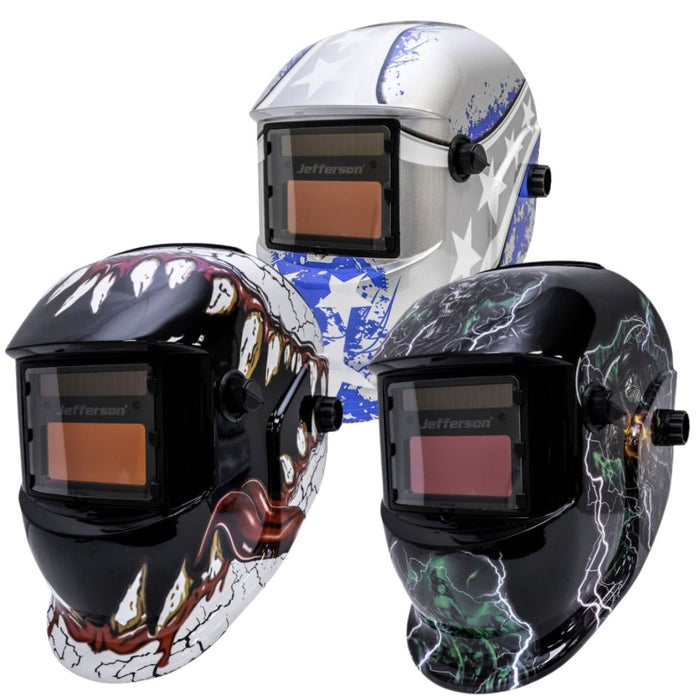 Three welding helmets with different designs on a white background