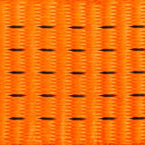 Close-up of orange fabric with black pattern
