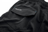 Close up of the Makita Axis Stretch Shorts in black showing the Makita logo on the rear pocket.