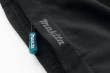 Close-up of the Makita Axis Stretch Shorts in black with a visible Makita logo on a white background