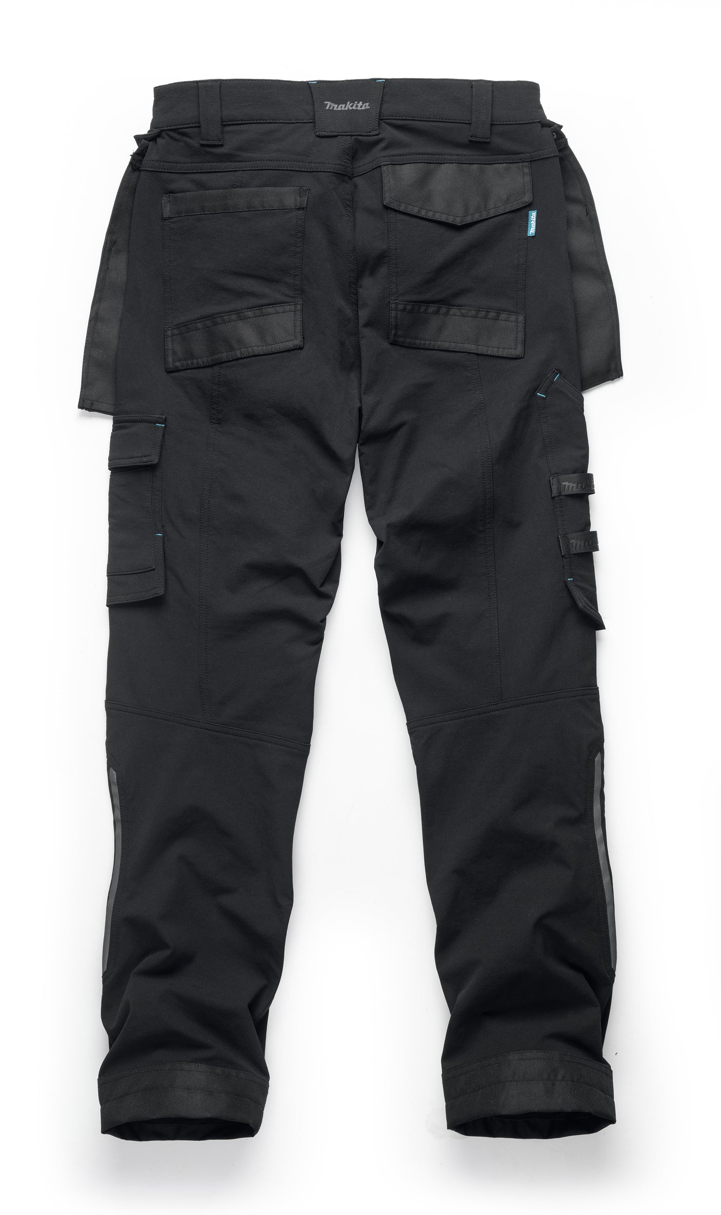 Black Makita Onyx 4 way stretch trousers with multiple pockets on a white background