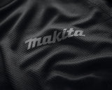 Close-up of Makita logo on a black Makita tech t shirt.