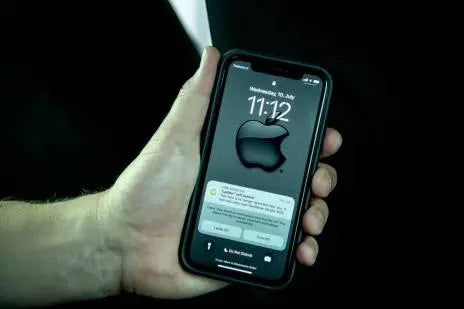 An image of an iphone held in a hand. Showing the time of 11:12 and a bunch of notifications from the app with tracking updates for Tools. 