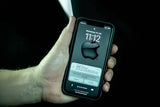An image of an iphone held in a hand. Showing the time of 11:12 and a bunch of notifications from the app with tracking updates for Tools. 