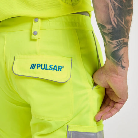 Close-up of a bright yellow safety jacket with Pulsar logo on a white background