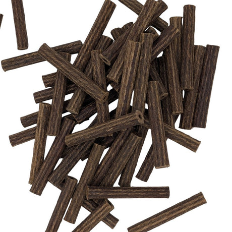 A pile of Rawlplug fibre plugs scattered on a white background.