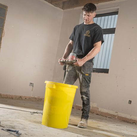Gorilla Bin™ 30L Mixing Bucket - Yellow RG30.Y shown being used for mixing