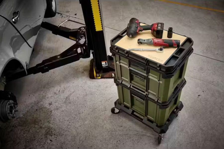 Bunker load up 32261 with tools next to a car lift in a garage setting