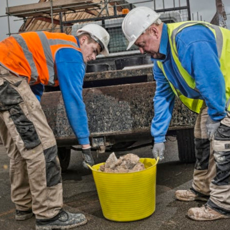 Yellow Red Gorilla Tub Small 14L being used to transport heavy bricks.