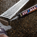 Person applying STIXALL extreme power sealant to a drain cover.
